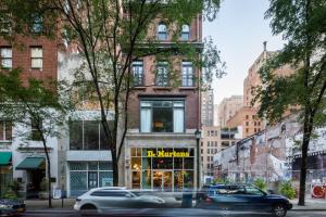 a store on a city street with cars in front at Sosuite at French Quarters - Rittenhouse Square in Philadelphia