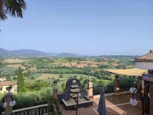 a view of the rolling hills from the balcony of a house at casa vacanze degli archi in Otricoli