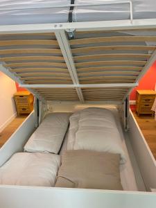 a bunk bed with two pillows on it at Chat rose in Charenton-le-Pont