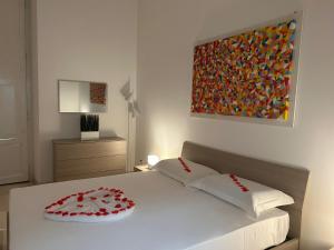 Cama ou camas em um quarto em B&B Baciami Ancora