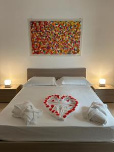 Cama ou camas em um quarto em B&B Baciami Ancora