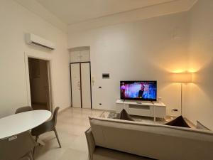 Uma TV ou centro de entretenimento em B&B Baciami Ancora