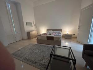 Cama ou camas em um quarto em B&B Baciami Ancora