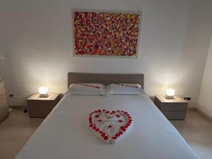 Cama ou camas em um quarto em B&B Baciami Ancora