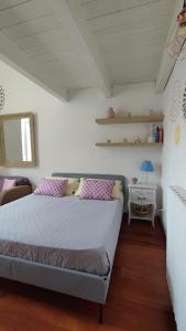 a bedroom with a bed and a table with a lamp at Mandala in Bari