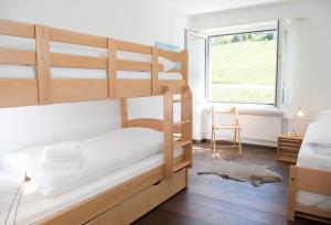 Voodi või voodid majutusasutuse Central flat for 6 persons Pianura Crapera Lenzerheide toas