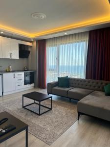 a living room with a couch and a table at Dolce Bella Suites in Trabzon