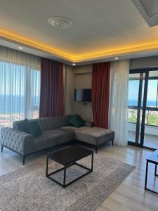 a living room with a couch and a table at Dolce Bella Suites in Trabzon