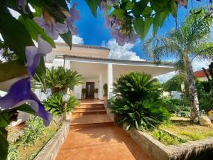 a villa with a view of the front of the house at The Rosa's Luxury House in Alezio
