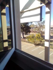 a window with a view of a parking lot at SUN1 Kimberley in Kimberley