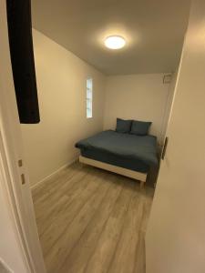 Een bed of bedden in een kamer bij Appartement Cosy