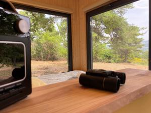 a camera on a table in front of a window at La Bastide Provençale - Terre d'Ocre & de Lavande in Viens