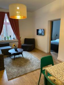 a living room with a couch and a table at Apartament Tuchola in Tuchola