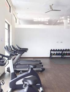 a gym with rows of exercise bikes in a room at Monde Residence H 15 Batam Centre in Sengkuang