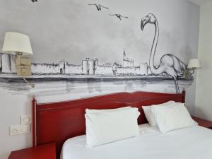 Postel nebo postele na pokoji v ubytování Logis VIGNES BLANCHES*** Hôtel Cosy et restaurant de terroir