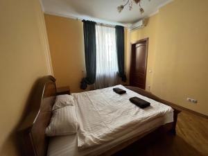 Postel nebo postele na pokoji v ubytování Central House з КОНДИЦІОНЕРОМ