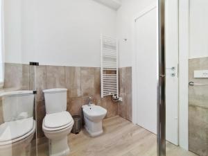 a bathroom with a toilet and a sink at Colleoni 19 Bangkok, appartamento superior in Civitanova Marche +20 photos