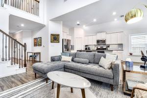 a living room with a couch and a table at Coronilla Bend - Main Home in Austin