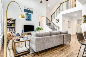 a living room with a couch and a tv at Coronilla Bend - Main Home in Austin