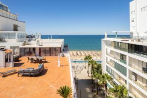a view of the ocean from the balcony of a building at Luxury Beachfront 2 Bedroom's Penthouse - Mar do Sol By Centralgarve in Quarteira