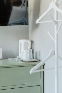 a appliance sitting on a counter in a room at Slottsparken Motel in Huskvarna