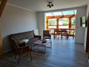 a living room with a couch and a table at Cityhaus in Parchim