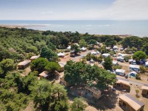 an aerial view of a campground next to the ocean at Huttopia Ars-en-Ré in Ars-en-Ré