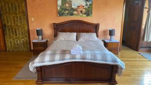Postel nebo postele na pokoji v ubytování La Antigua Hotel de Montaña