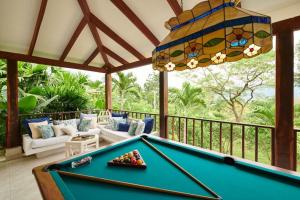 a pool table in a living room with a pool table at Finca San Pedro in La Mesa