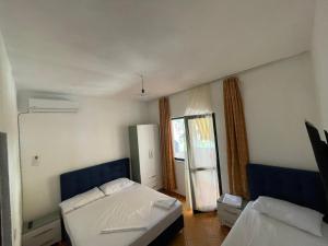 Postel nebo postele na pokoji v ubytování Hotel Ani