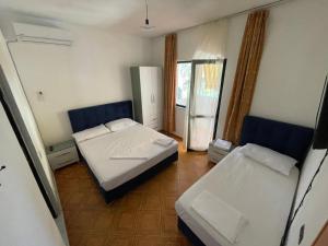 Postel nebo postele na pokoji v ubytování Hotel Ani
