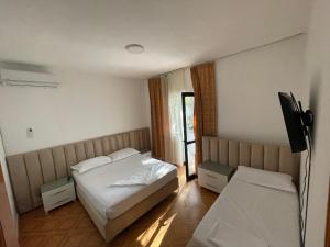 Postel nebo postele na pokoji v ubytování Hotel Ani
