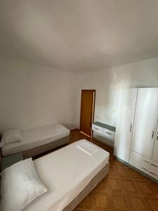 Postel nebo postele na pokoji v ubytování Hotel Ani