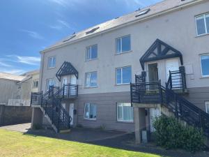 a building with stairs on the side of it at Holiday Apartment Iris in Waterford