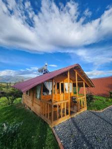 a house with a roof on top of it at Glamping El Muelle in Villa de Leyva