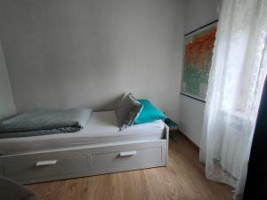 A bed or beds in a room at Piccolo Appartamento Casa Vacanze B&B Angela