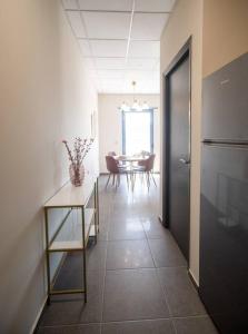 a hallway with a table and a dining room at Luxury Apartment in Chalkida #2 in Chalkida