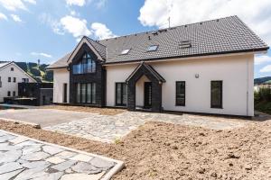 a house under construction with a driveway at Mirabel Apartments Klinovec in Loučná pod Klínovcem