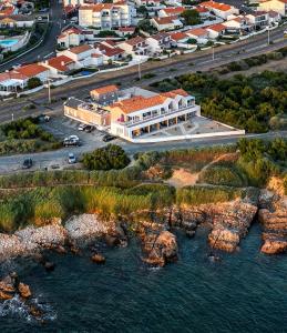 an aerial view of a building next to the water at La Vigie Vacances in Les Sables-dʼOlonne