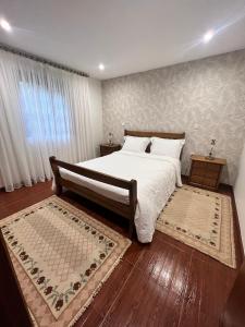 Postel nebo postele na pokoji v ubytování Bouça do Sossego