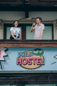 a man and a woman standing on top of a building at PhiliPop-Up Hostel in Scharnitz