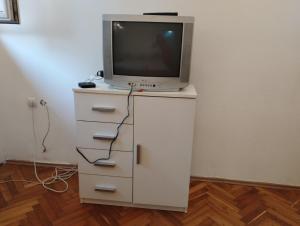 a tv sitting on top of a white dresser at Dana in Trnava