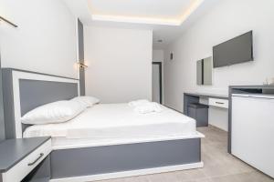 Postel nebo postele na pokoji v ubytování Pera Side Hotel