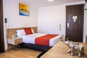 Katil atau katil-katil dalam bilik di Nogal Suite Hotel Ipiales