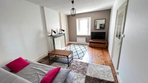 Postel nebo postele na pokoji v ubytování Au pied du donjon