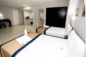 Postel nebo postele na pokoji v ubytování Hotel Caribe Internacional Cancun