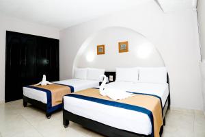 Postel nebo postele na pokoji v ubytování Hotel Caribe Internacional Cancun