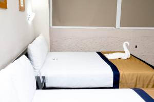 Postel nebo postele na pokoji v ubytování Hotel Caribe Internacional Cancun