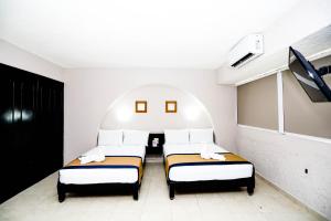 Postel nebo postele na pokoji v ubytování Hotel Caribe Internacional Cancun