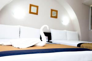 Postel nebo postele na pokoji v ubytování Hotel Caribe Internacional Cancun
